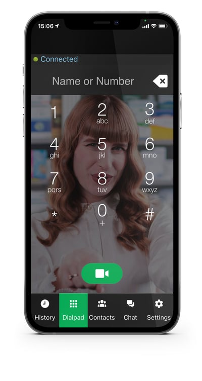A woman with long red hair is wearing a white blouse. She is featured on the review display within the demo of the Convo Australia dialpad app.